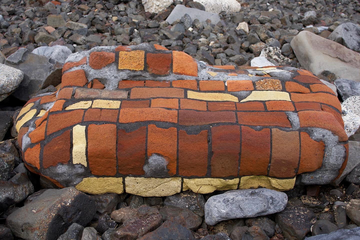 A rock that looks like a brick-pattern quilt